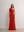 Model in A.B.C A BRAND COLLECTIVE red gown; showcasing the sleek viscose-nylon blend and elegant asymmetrical silhouette.
