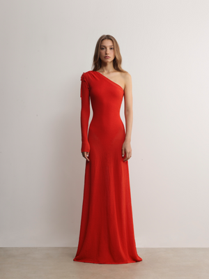 Model in A.B.C A BRAND COLLECTIVE red gown; showcasing the sleek viscose-nylon blend and elegant asymmetrical silhouette.