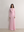 Tailored A.B.C A BRAND COLLECTIVE long sleeve dress featuring a subtle front cut out and sophisticated floor length drape