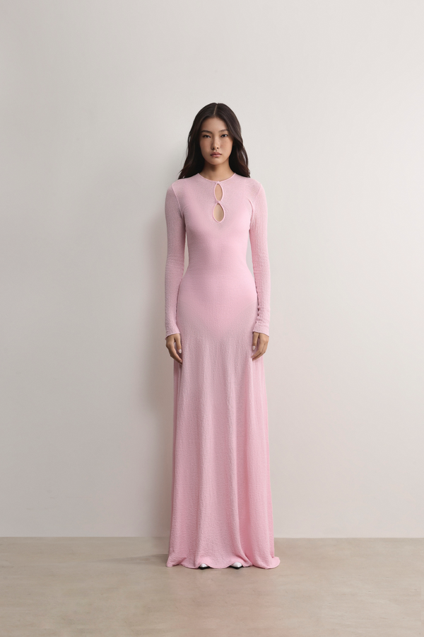 Tailored A.B.C A BRAND COLLECTIVE long sleeve dress featuring a subtle front cut out and sophisticated floor length drape