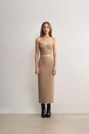 Model styling the beige Fawkner Milano Knit Pencil Skirt with matching bustier A.B.C A BRAND COLLECTIVE sophisticated set