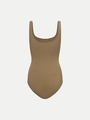 Back view of the beige Alma Bodysuit A.B.C A BRAND COLLECTIVE showing the timeless scooped neckline.