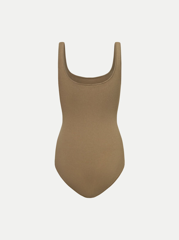 Back view of the beige Alma Bodysuit A.B.C A BRAND COLLECTIVE showing the timeless scooped neckline.