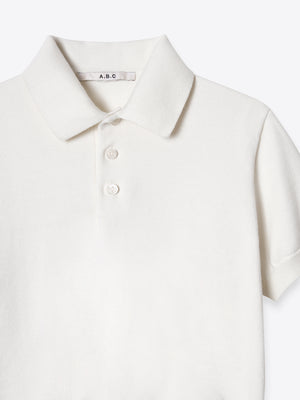 Close-up of the structured collar and button placket on the ivory Kyneton Polo A.B.C A BRAND COLLECTIVE.