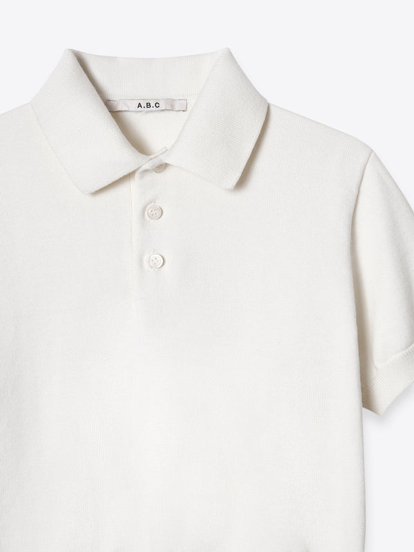 Close-up of the structured collar and button placket on the ivory Kyneton Polo A.B.C A BRAND COLLECTIVE.