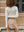 Back view of the ivory Mona Full Needle Rib Merino Wool Turtle Neck Top A.B.C A BRAND COLLECTIVE durable layering versatility