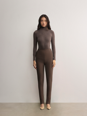 Standing model styling the mocha Mona Full Needle Rib Merino Wool Turtle Neck Top A.B.C A BRAND COLLECTIVE sleek structured fit