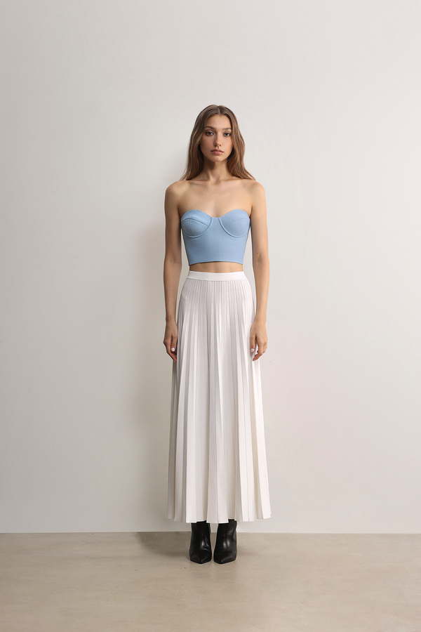 Model styling the white Prahran Pleat Knit Midi Skirt A.B.C A BRAND COLLECTIVE effortless drape and comfort