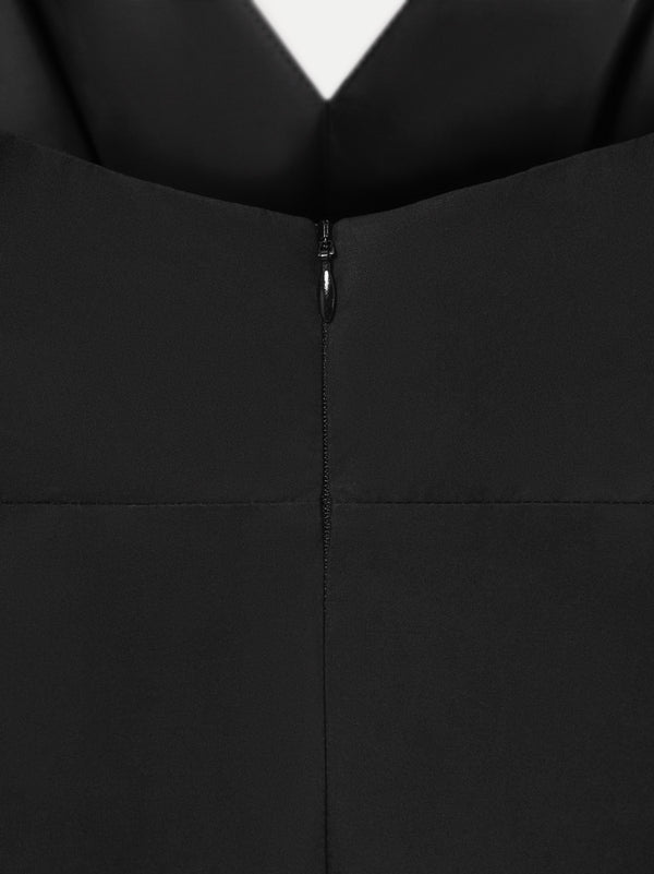 Back detail of black MOREE dress by A.B.C A BRAND COLLECTIVE, subtle shaping with a clean finish in cotton fabric.