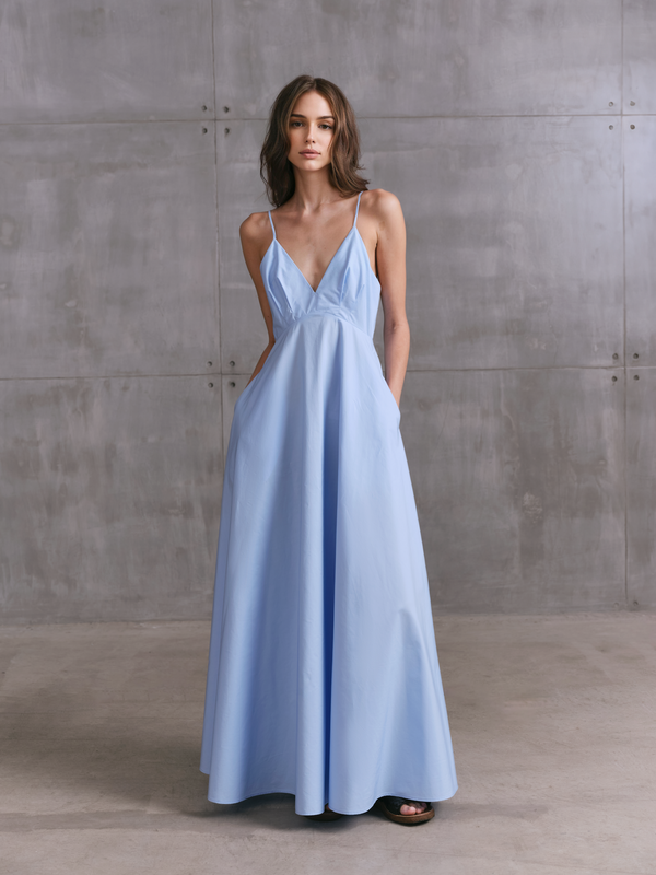 Model wearing blue MOREE maxi dress by A.B.C A BRAND COLLECTIVE, relaxed drape with breathable cotton for warm days.