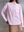 Model wearing pink MOREE relaxed shirt by A.B.C A BRAND COLLECTIVE, soft drape and comfortable movement in cotton fabric.