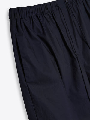 Detailed close-up of the secure drawstring waist and side pockets, highlighting the breathable 100% Good Earth Cotton texture.