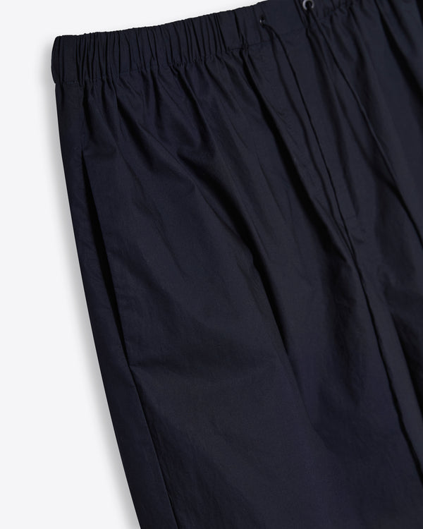 Detailed close-up of the secure drawstring waist and side pockets, highlighting the breathable 100% Good Earth Cotton texture.