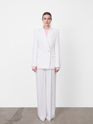 White A.B.C A BRAND COLLECTIVE jacket featuring a double breasted front closure and a sharply tailored longline cut