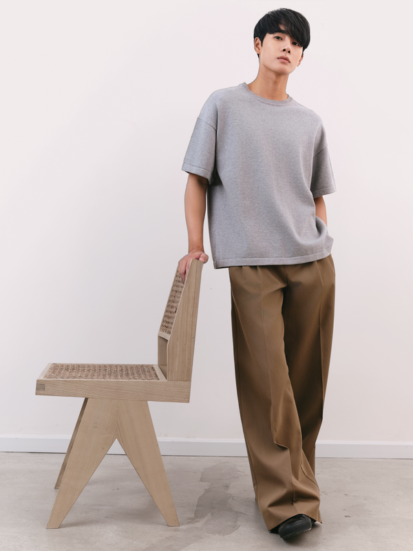 Model wears A Brand Collective Kyneton Relaxed Fit Short Sleeve Knit Tee made of Good Earth Cotton.