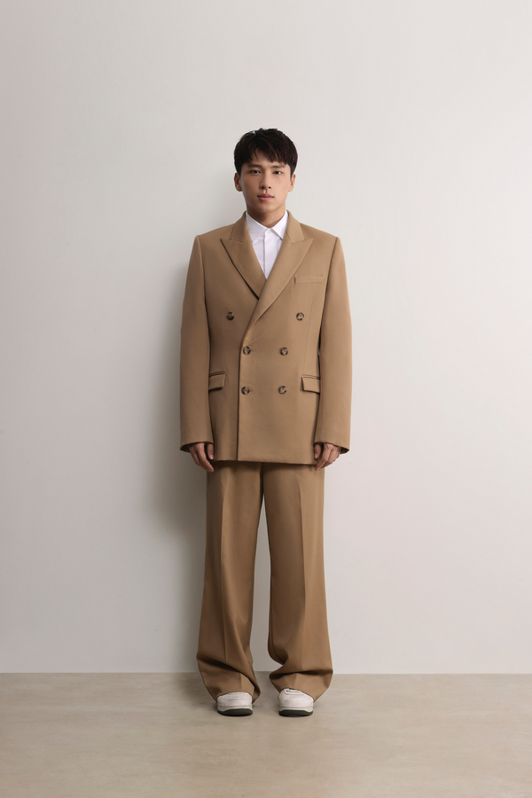 Model wearing Fitzroy Flat Front Straight Leg Trousers made of 100% Fibre Trace Wool by A.B.C. 