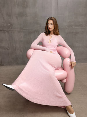 Impactful fashion details on an A.B.C A BRAND COLLECTIVE pink gown with distinctive keyhole styling and professional tailoring