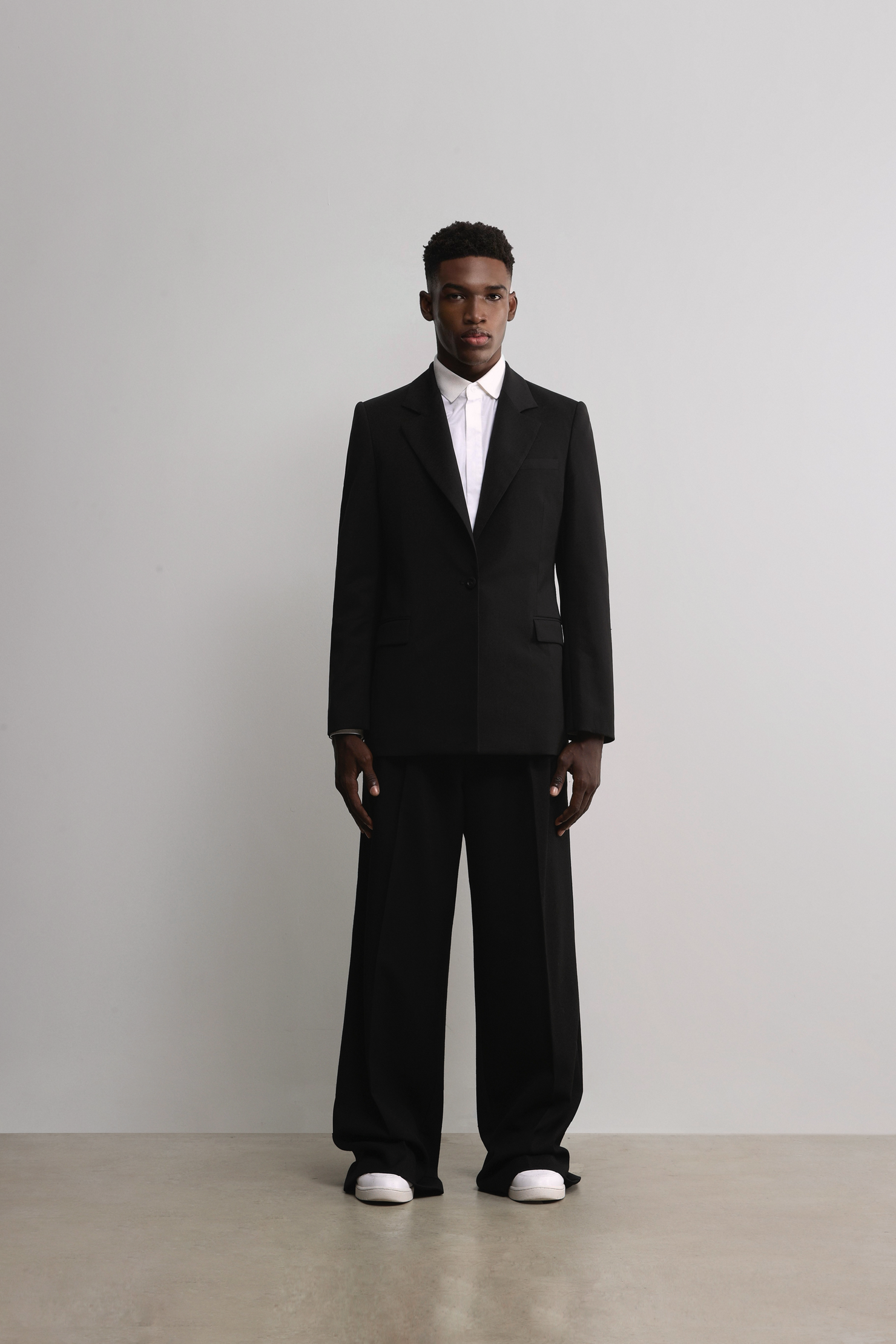 Male model wears the woven items from woven collection.